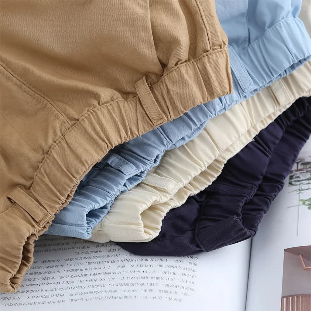 Pair of folded breathable cotton shorts for boys, ideal summer playwear.