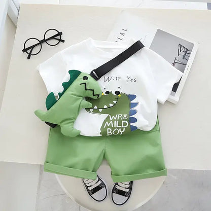 Stacked view of the folded boys' Dino Dash cotton t-shirt and shorts set, ready for warm weather