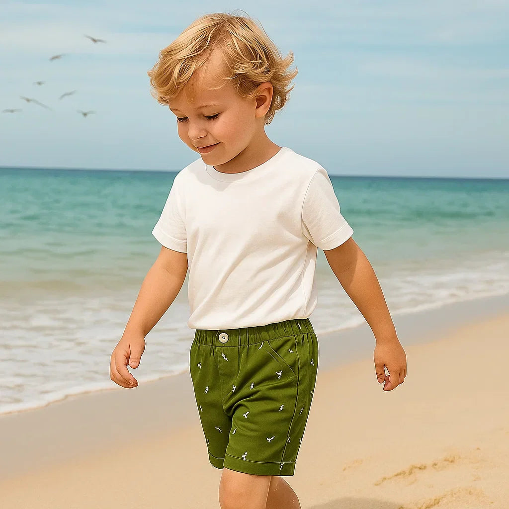 Pair of vibrant kids summer shorts with fun dino print for active play