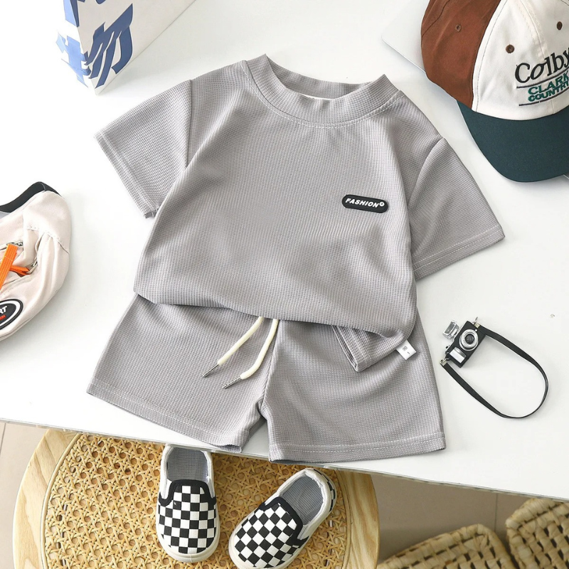 Newborn boy in a comfortable green cotton summer outfit, perfect for everyday wear