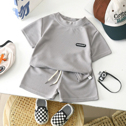 Newborn boy in a comfortable green cotton summer outfit, perfect for everyday wear