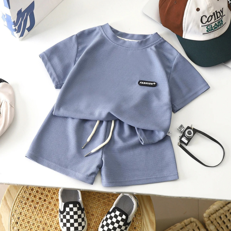 Soft cotton summer outfit for boys, featuring a short-sleeve top and elastic shorts