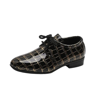Side view of boys' brown leather flats, toddler size, casual style with robust rubber sole