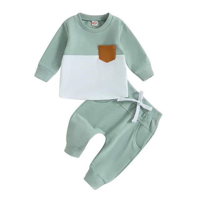 Zoomed-in texture of the cotton blend fabric on a toddler tracksuit, emphasizing softness