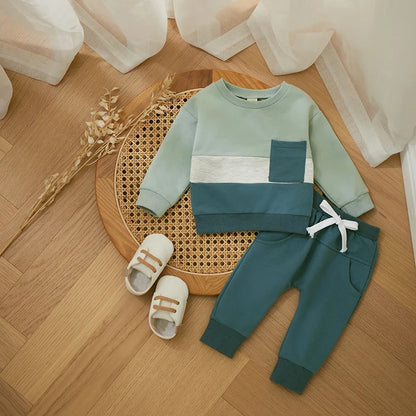 Close-up of a toddler boys' tracksuit showing soft cotton blend fabric and vibrant color