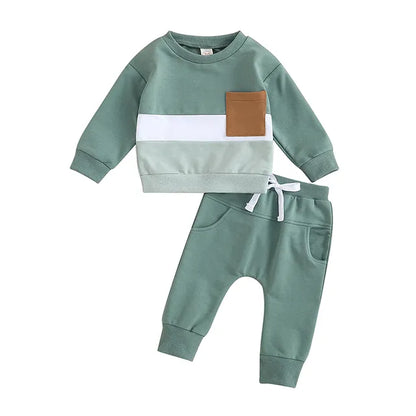 Detail shot of the elastic waistband and cuffed ankles on a toddler tracksuit pants set
