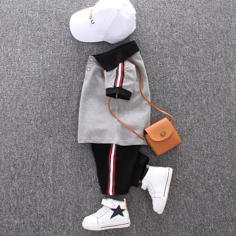 Cute toddler male's summer clothing set with a cotton polo and elastic waist shorts