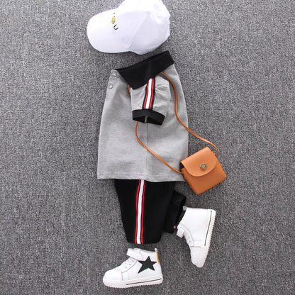 Cute toddler male's summer clothing set with a cotton polo and elastic waist shorts