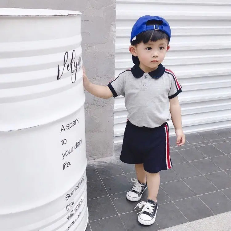 Comfortable cotton toddler boys outfit, a stylish blue polo top and coordinating shorts