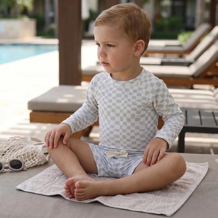 Toddler boys' long sleeve UPF 50+ swim set for sun protection, perfect for beach and pool fun.