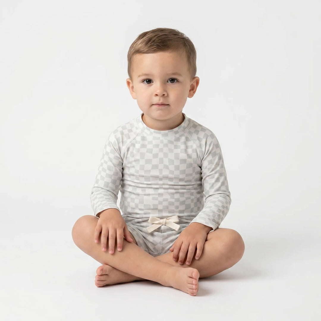 Blue long sleeve UPF 50+ swimwear set for toddler boys, ideal for active play at the beach or pool.