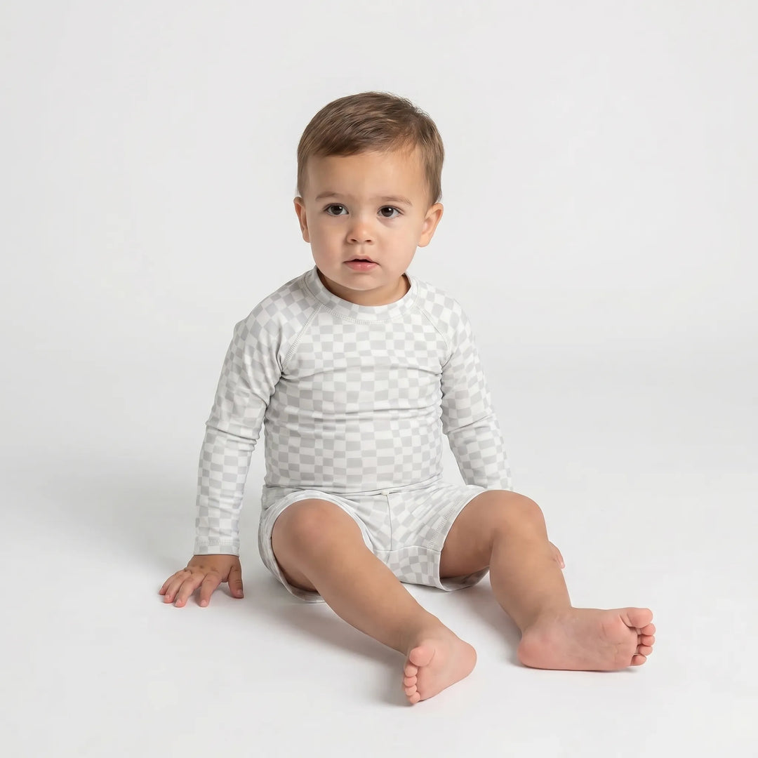 Toddler boys' long sleeve UPF 50+ swim set, perfect vacation clothes for summer beach fun.