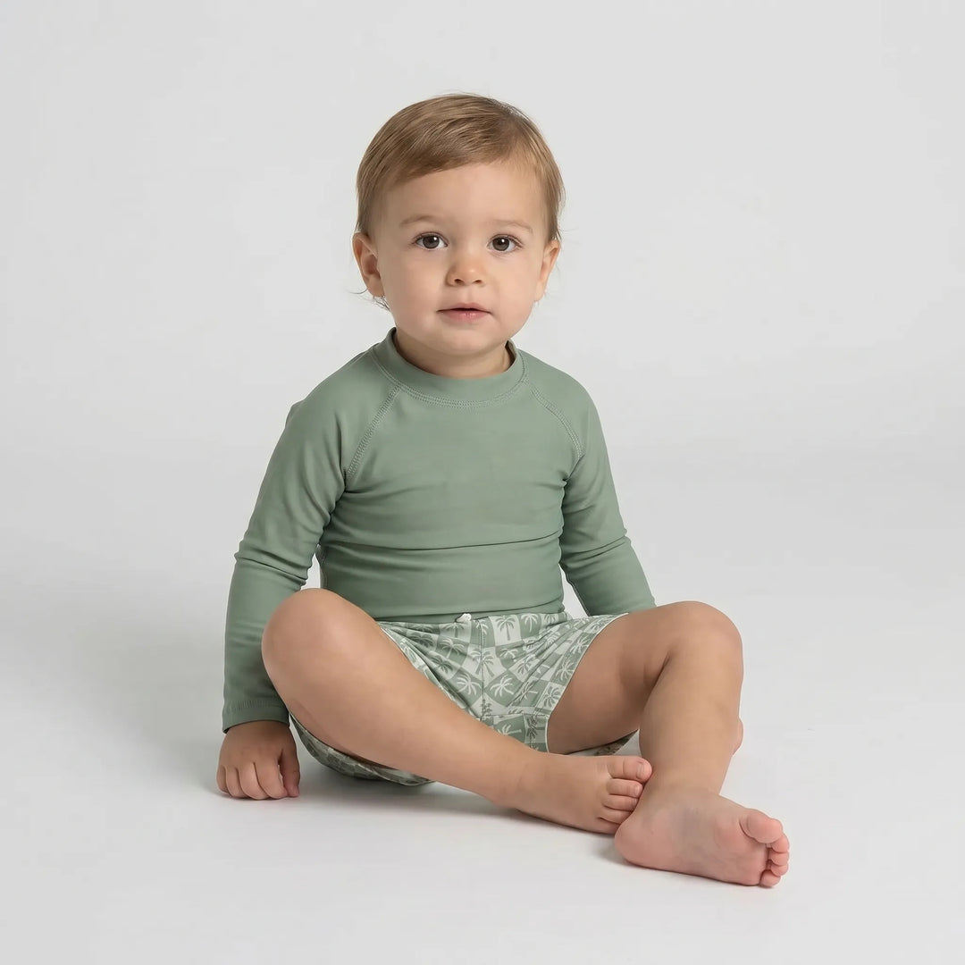 Stylish long sleeve UPF 50+ swim shirt and shorts set for toddler boys, great for sunny days.
