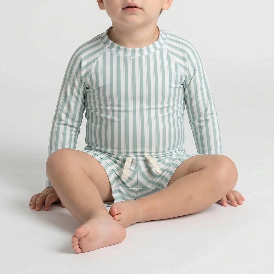 Safe UPF 50+ long sleeve swimwear set for toddler boys, ensuring sun protection during water play.