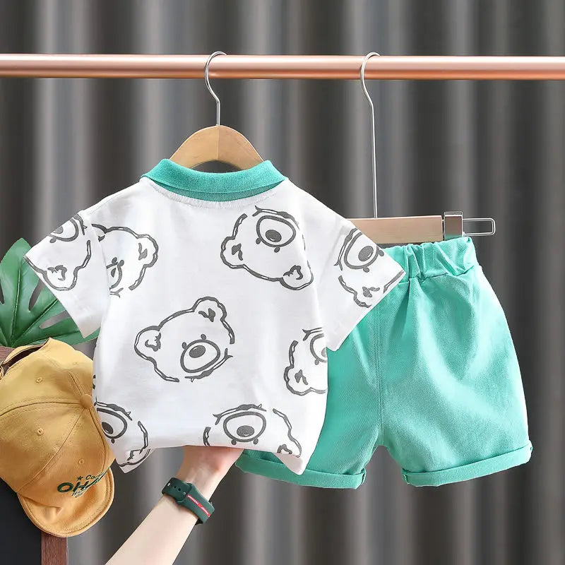 Comfortable toddler tracksuit featuring a cartoon bear t-shirt and solid shorts.