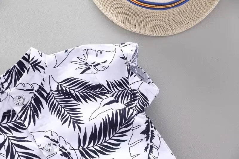 Play-ready toddler boys' summer outfit, cotton blend top with fun design and solid color shorts.