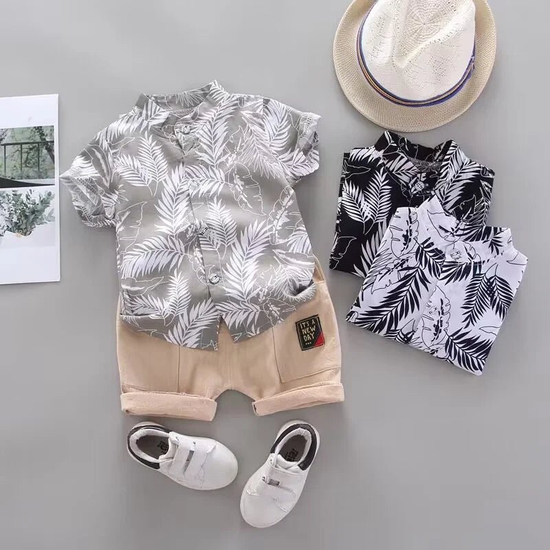 Comfortable toddler boys' summer outfit, cotton tee with animal print and pull-on shorts, ideal for play.