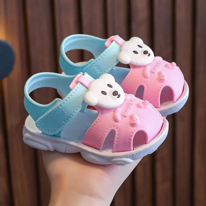 Toddler girl in pink cartoon sandals, quick-dry infant footwear for beach and water play