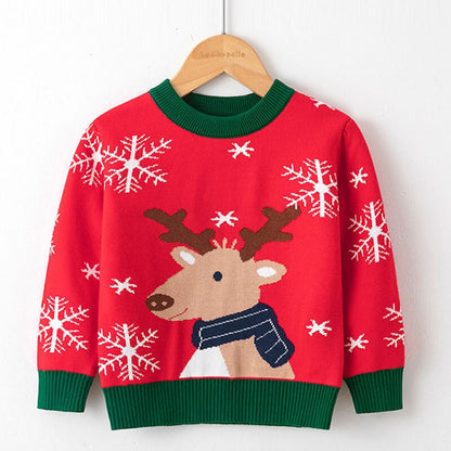 Child modeling a stylish reindeer knitwear sweater, perfect winter fashion outfit