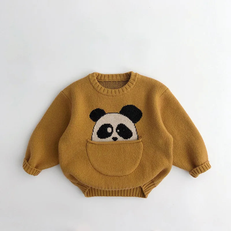 Detail of the soft cotton fabric and vibrant animal print on a kids' pouch pocket sweater.