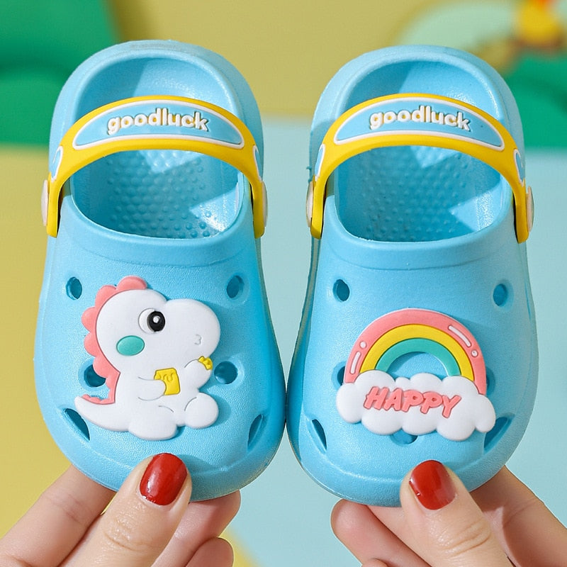 Purple toddler croc sandals with playful dinosaur graphics for boys & girls