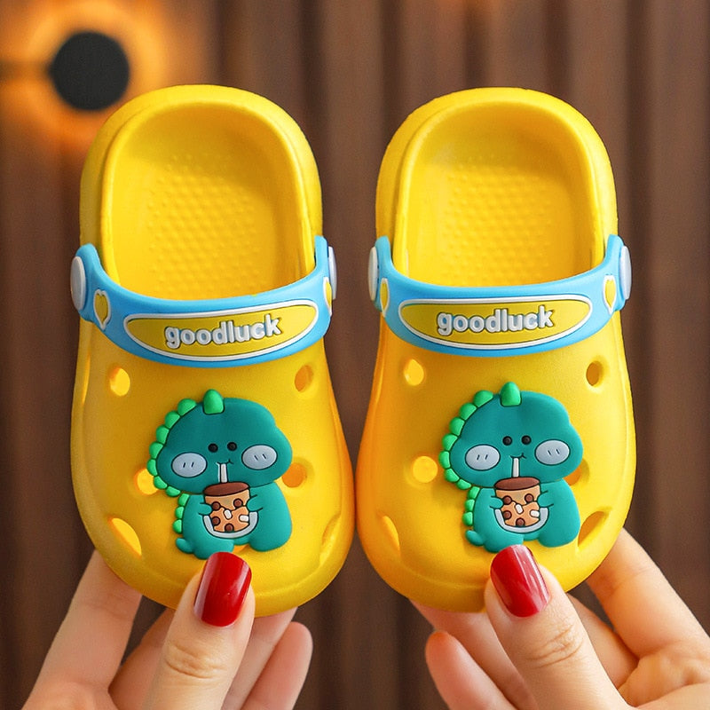 Orange toddler sandals with dinosaur theme, great for poolside fun
