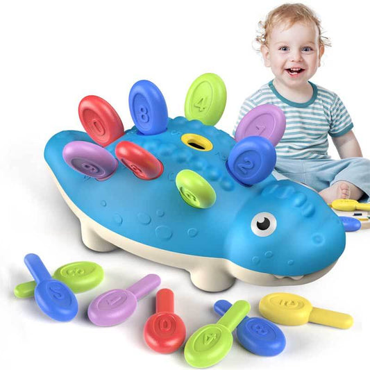 Toddler dinosaur fine motor skill sorting toy with large colorful spikes and base for educational play.