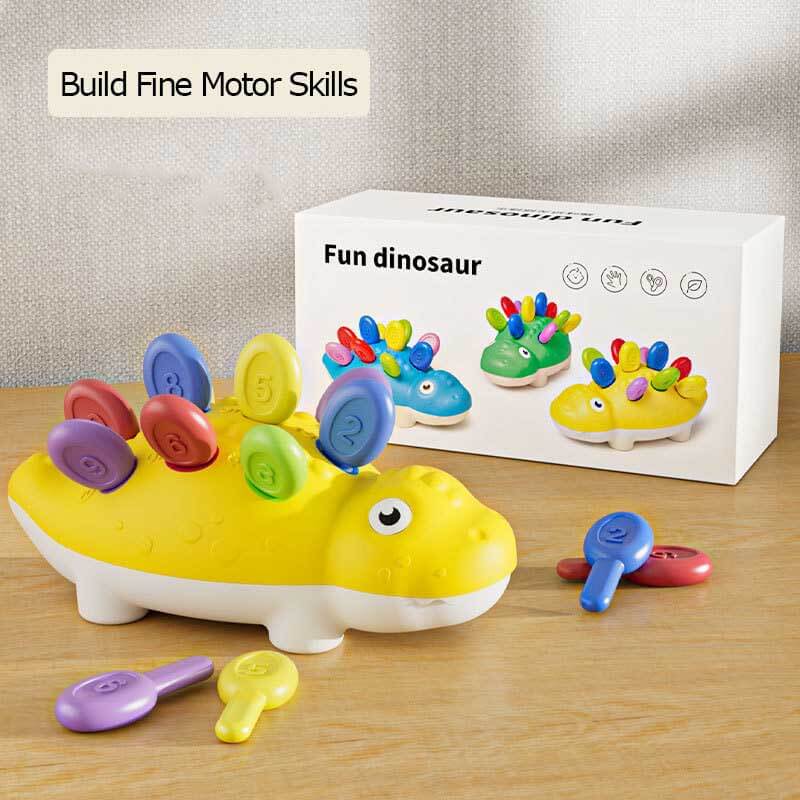 Brightly colored dinosaur activity toy with removable spikes, perfect for toddler fine motor learning.