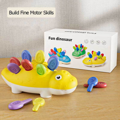 Brightly colored dinosaur activity toy with removable spikes, perfect for toddler fine motor learning.