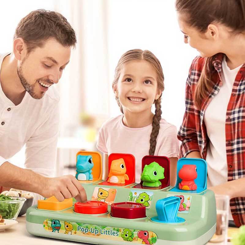Interactive baby dinosaur pop-up toy with various levers, ideal for toddler motor skill development