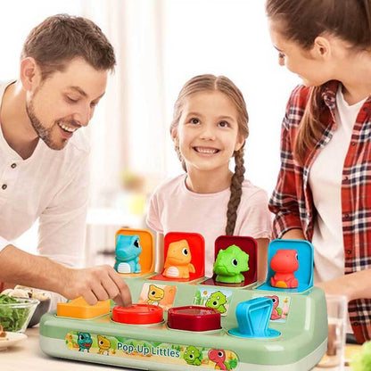Interactive baby dinosaur pop-up toy with various levers, ideal for toddler motor skill development