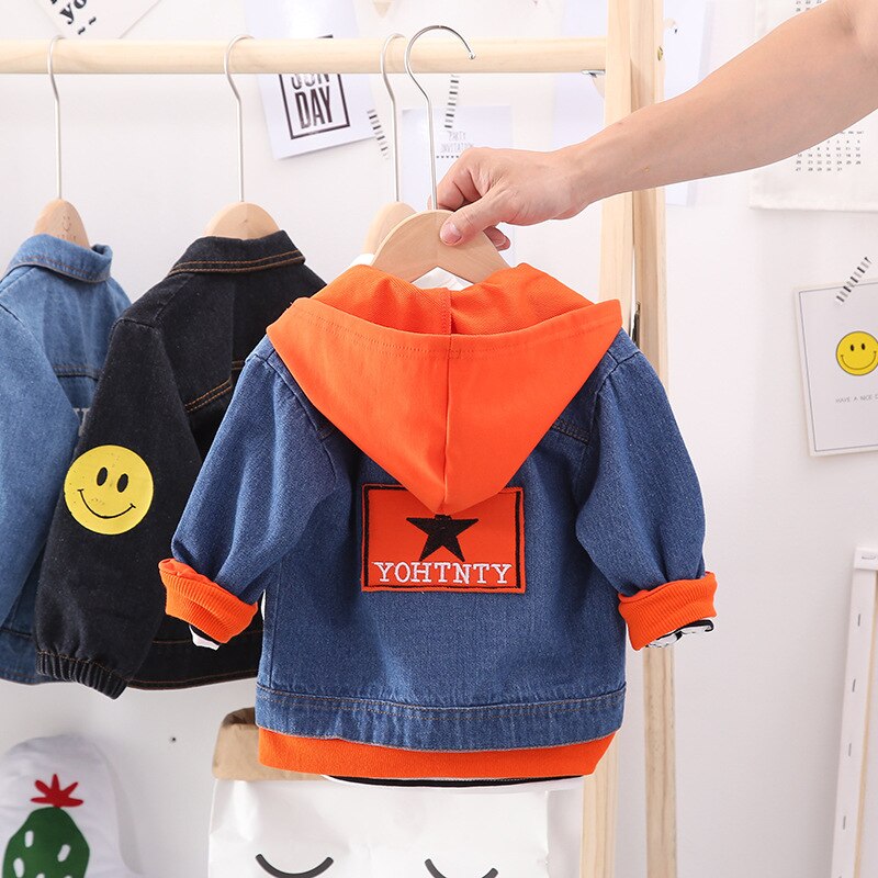 Back of a toddler's blue hooded zipper jacket, showcasing the cute dog print and durable cotton fabric.
