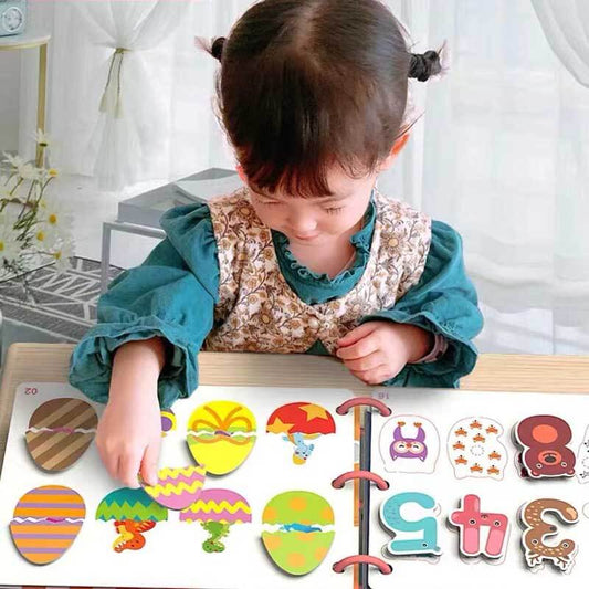 Toddler engaged with felt cognitive learning quiet book, sorting colorful shapes, promoting early development