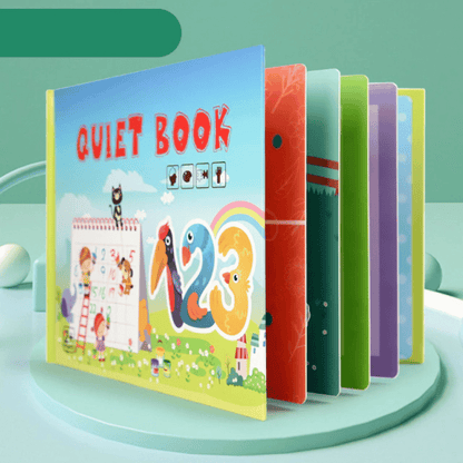 Happy child playing with a busy book, focused on an educational activity that builds skills.