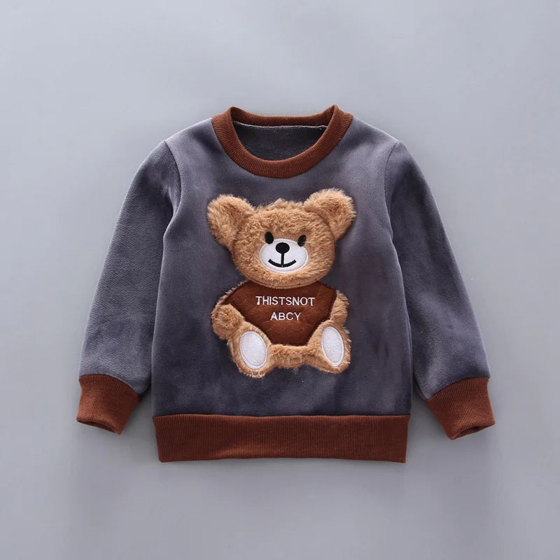 Toddler girl smiling in cozy bear print fleece winter set, infant apparel