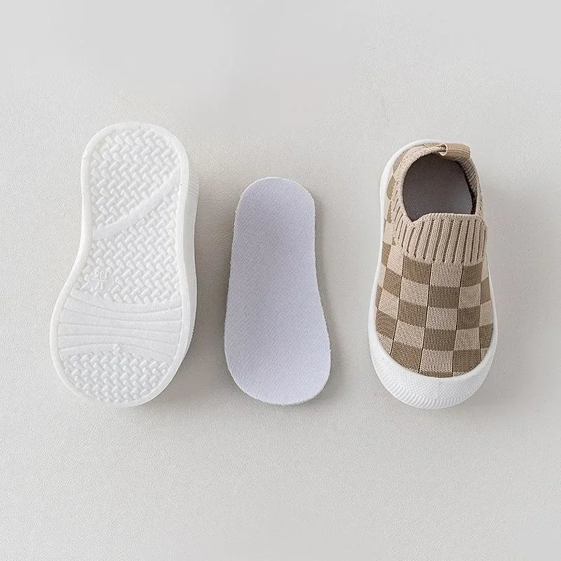Baby shoes: Flexible slip-on shoes for toddlers, featuring a grey and white pattern.