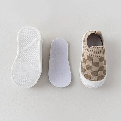Baby shoes: Flexible slip-on shoes for toddlers, featuring a grey and white pattern.