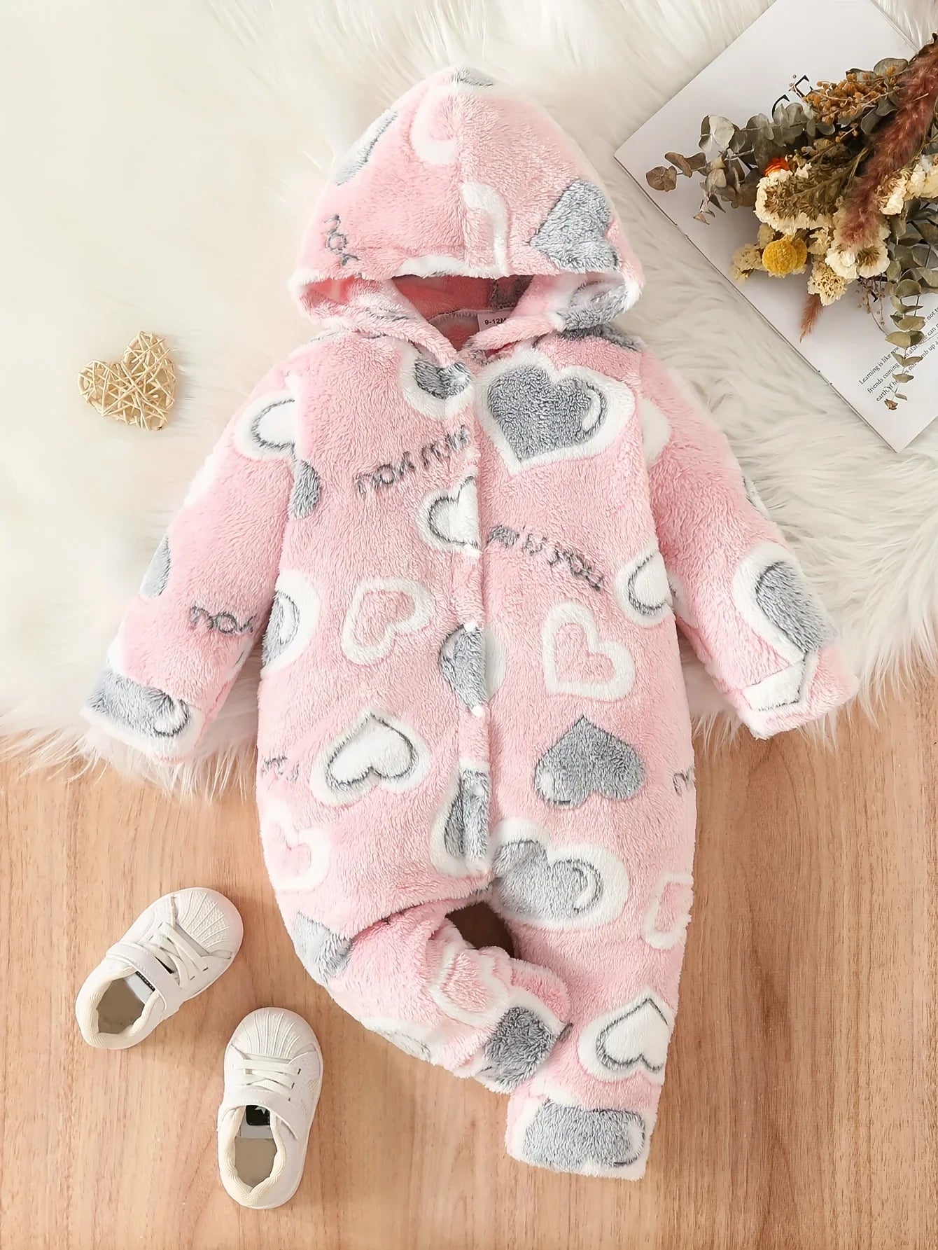 Back view of fuzzy pink heart toddler winter romper, cozy and stylish babywear