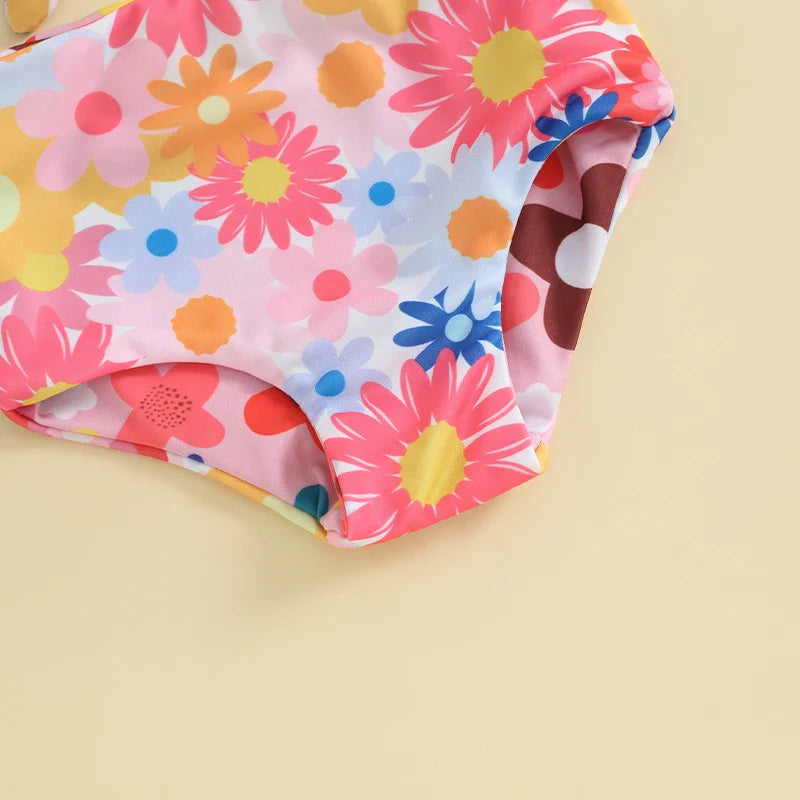 Baby girl's floral two-piece swimsuit, ruffled design, perfect for pool or beach play