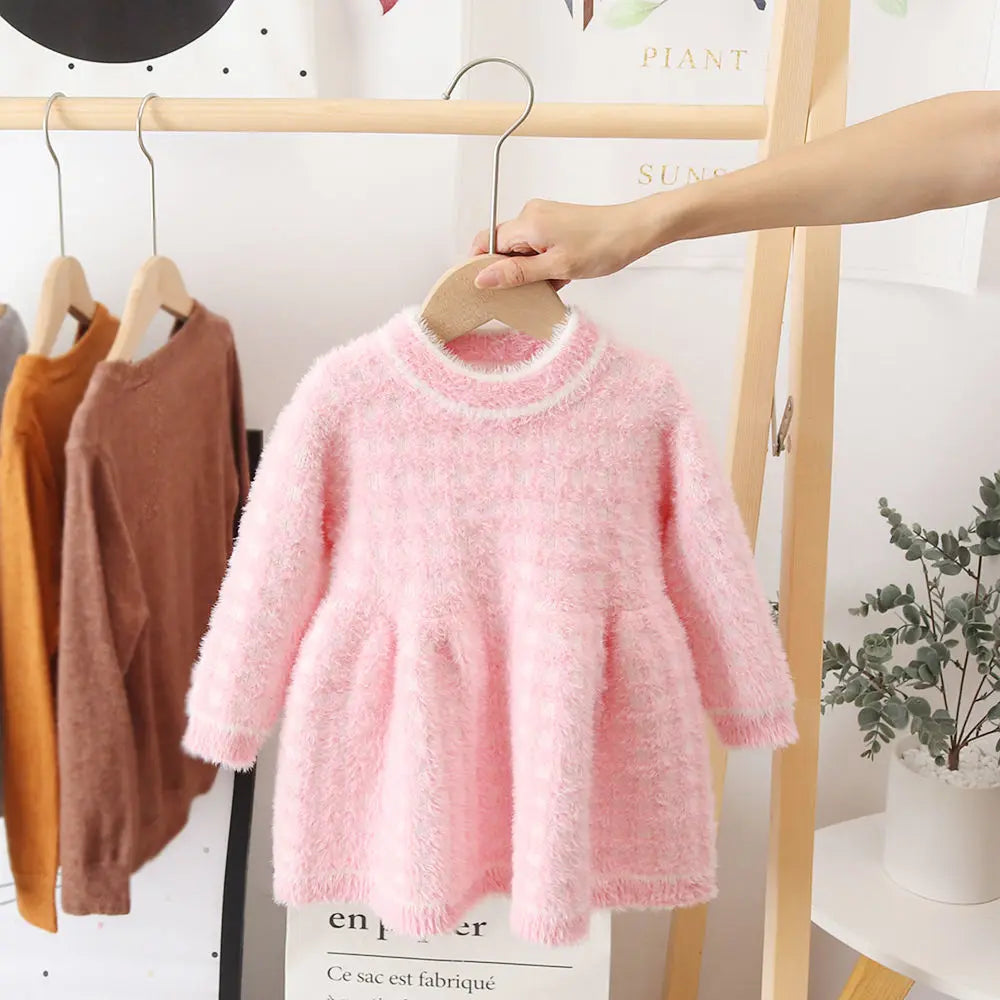 Adorable pink fleece girls' dress, a warm and fashionable winter clothing essential for toddlers.