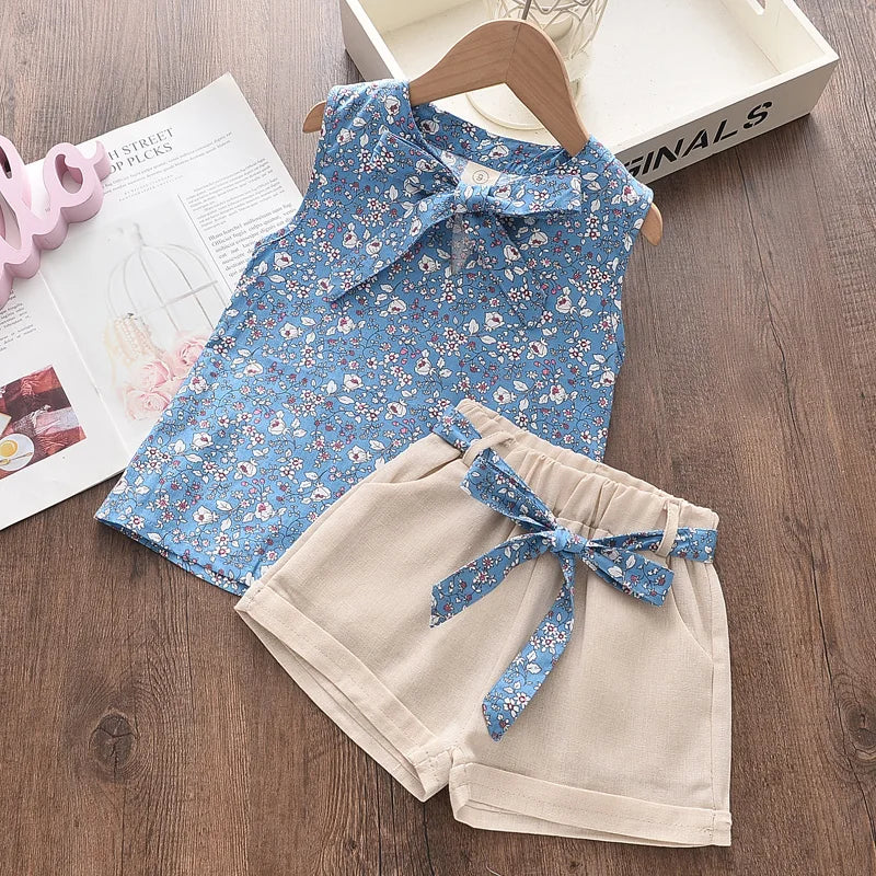 Toddler girl in a floral blouse and matching pants set, perfect soft cotton summer playwear.