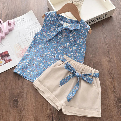 Toddler girl in a floral blouse and matching pants set, perfect soft cotton summer playwear.