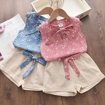 Close-up of a vibrant floral print blouse for toddlers, part of a comfy summer outfit set.