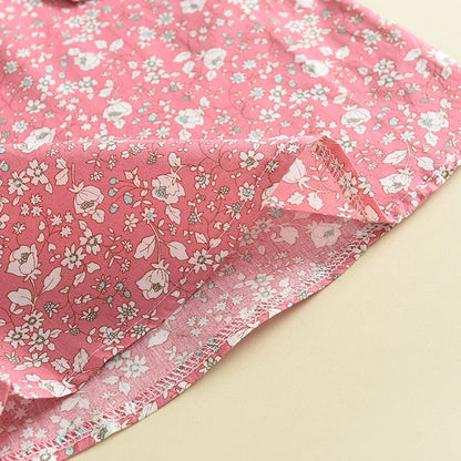 Girl's comfortable cotton blend floral blouse and pants set, ideal for summer playwear.