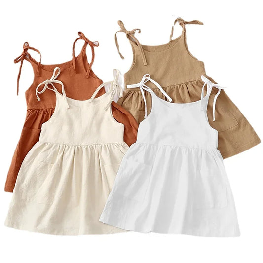 Toddler girl in a pink sleeveless cotton A-line dress, perfect for summer comfort and play.