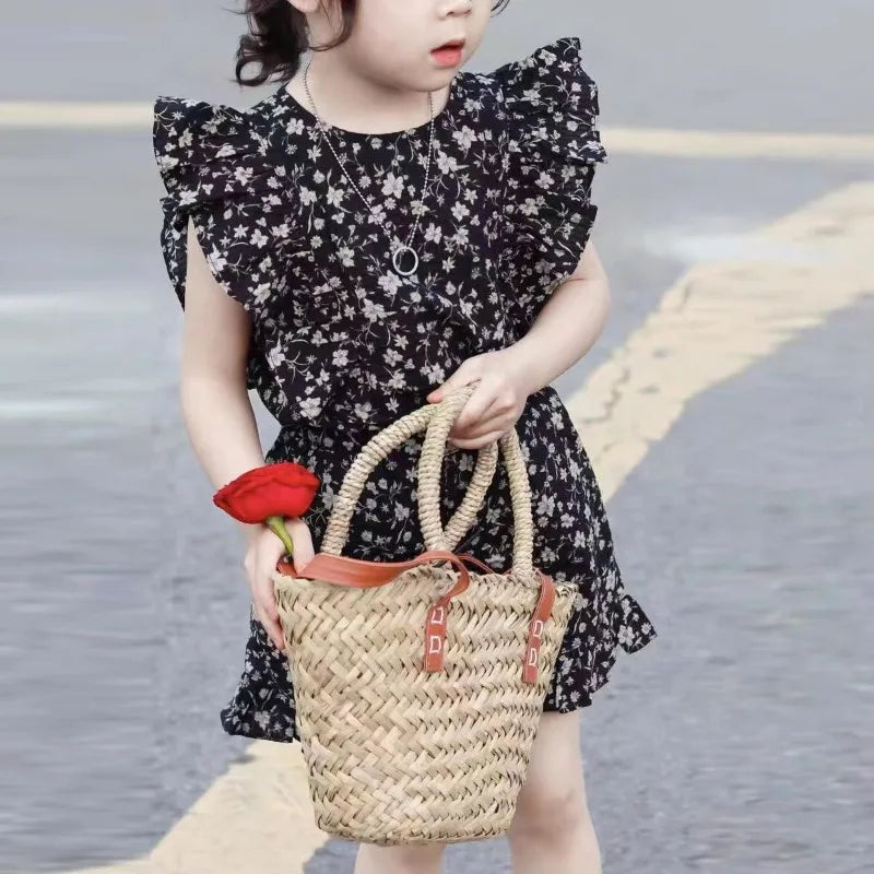 Toddler girl in a vibrant floral summer dress, perfect for warm weather or playdates.