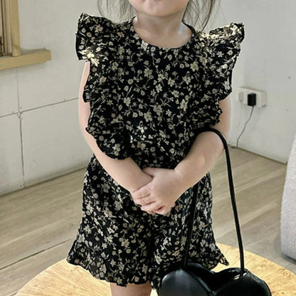 Close-up of a comfortable cotton floral summer dress for toddlers, showcasing the print.