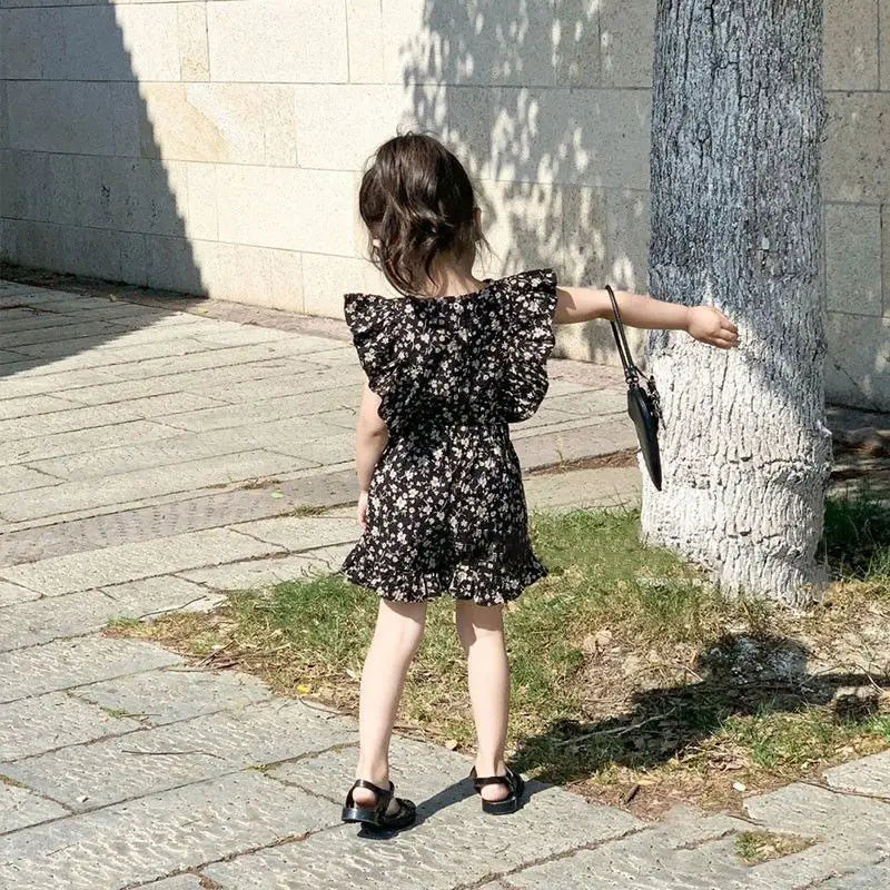Adorable toddler floral dress in bright colors, ideal kids clothing for summer adventures.