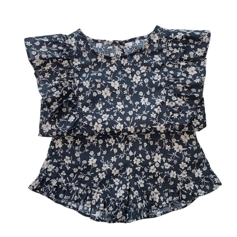 Back view of a girls' floral summer dress, highlighting its comfortable fit for toddlers.