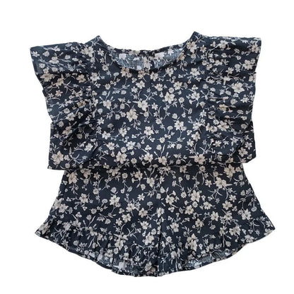 Back view of a girls' floral summer dress, highlighting its comfortable fit for toddlers.